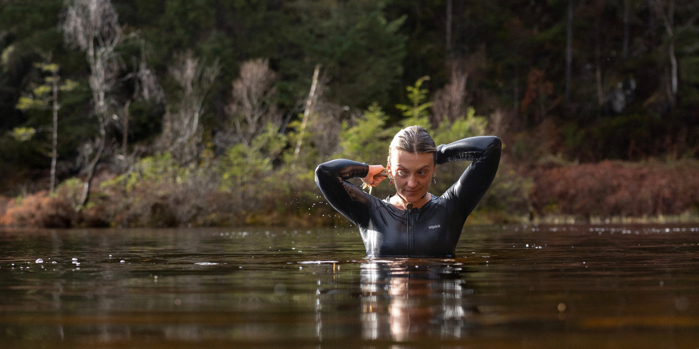 Outdoor swimmer in clear loch