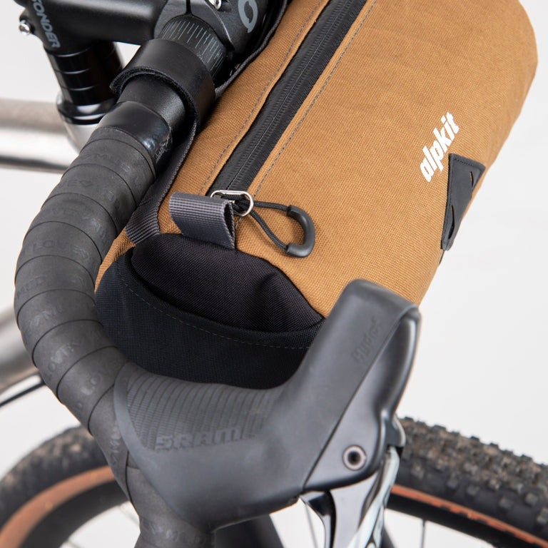 alpkit toploader zipped handlebar bag in mountain brown mesh pockets