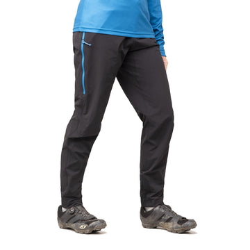 Woman cyclist wearing padded cargo bib shorts