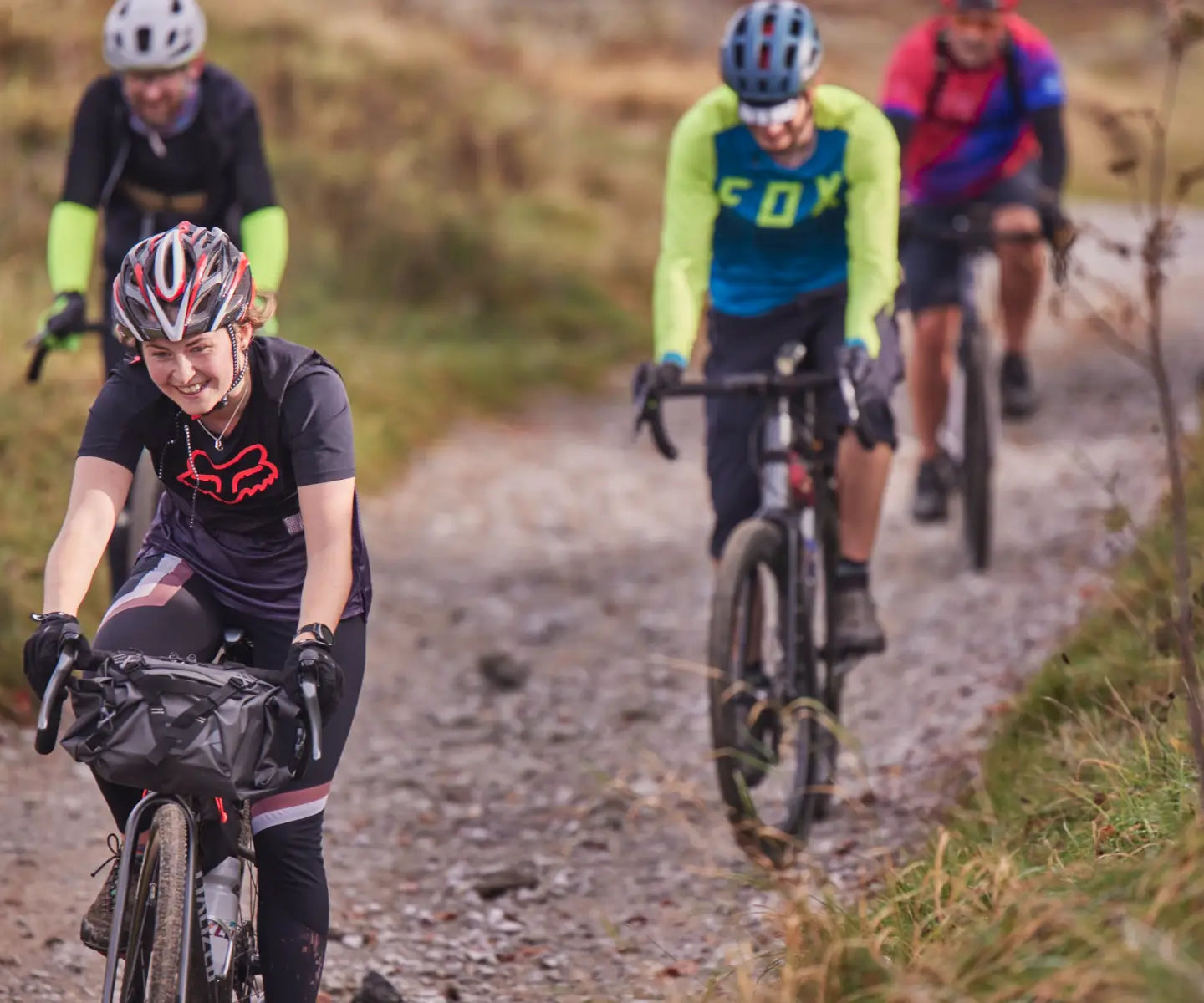 Group of cyclists riding gravel paths in the Peak District