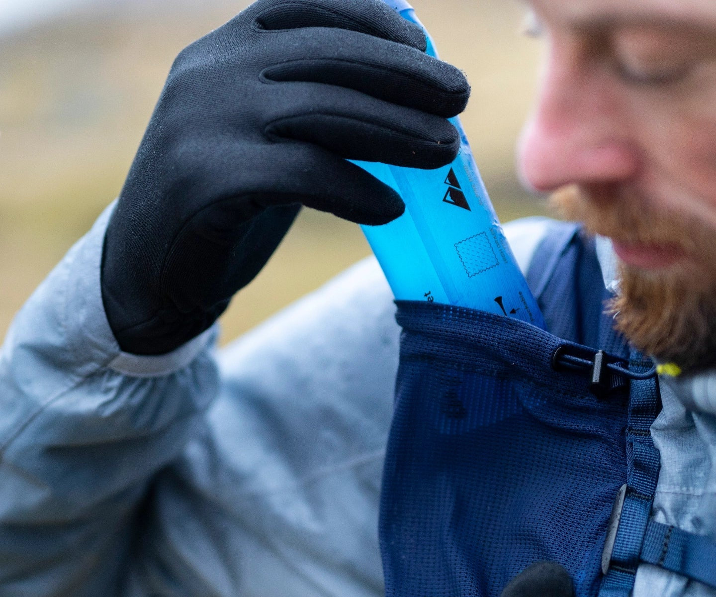 Trail runner rehydrating