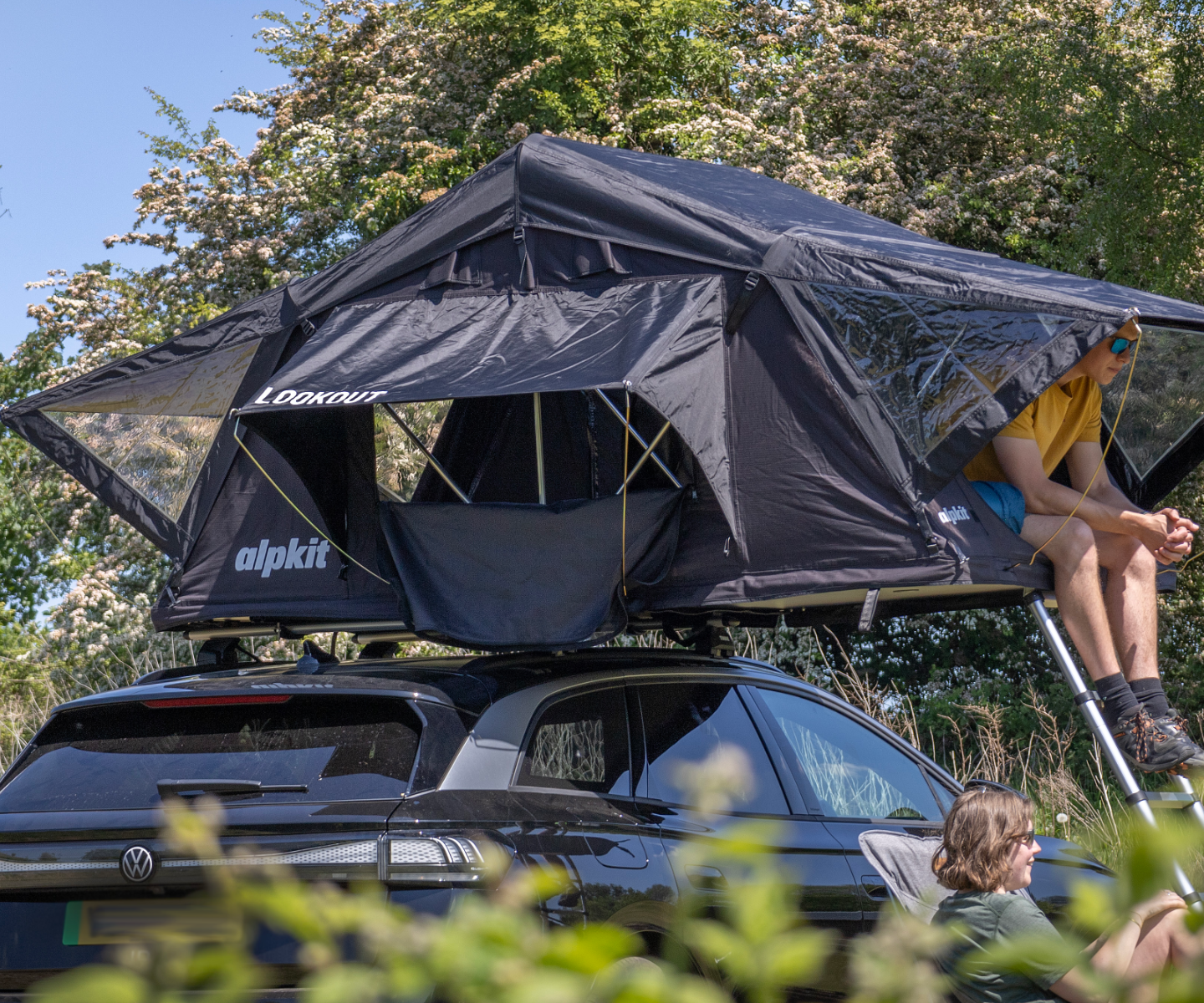 Camper sitting in a roof tent