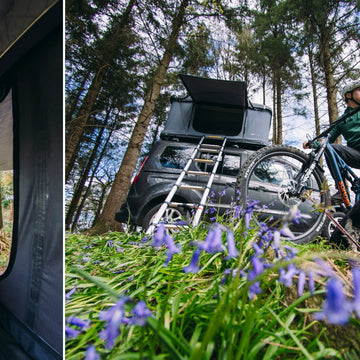 Campers sitting outside a bell tent