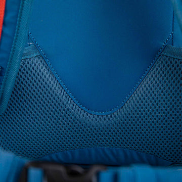 Hikers wearing different sized rucksacks atop a mountain