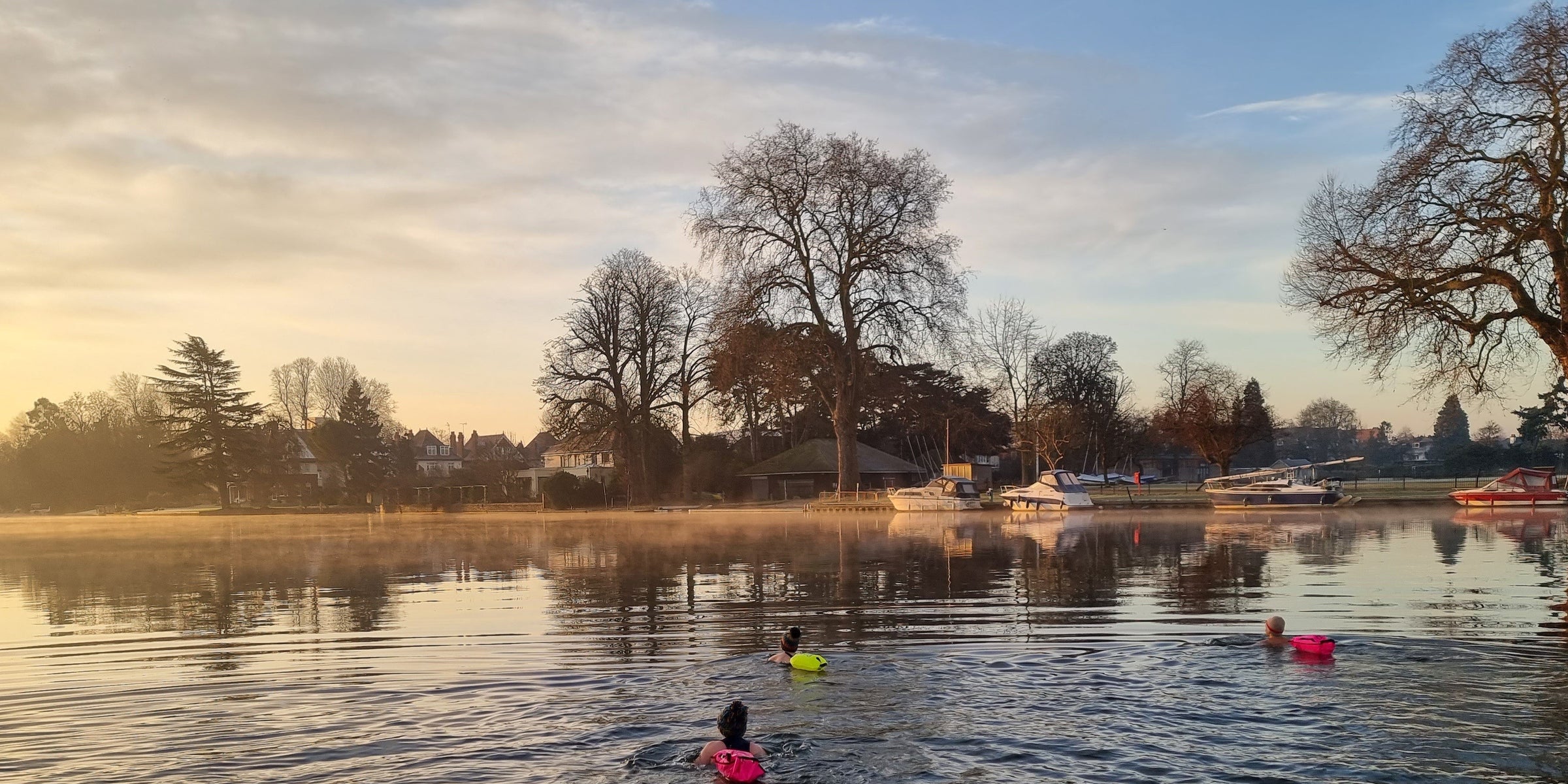Outdoors swimming with floats in the river Thames