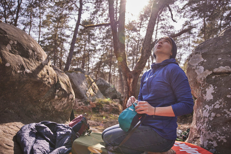 bouldering in Font with a chalk bag - action