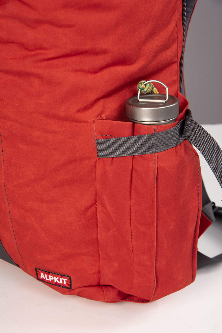 Alpkit brevet wax cotton pack in rust bottle pocket - closed