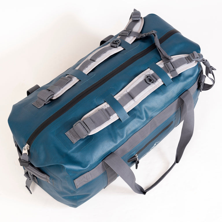 alpkit drydock 50L waterproof duffle bag gear bag in blue backpack straps