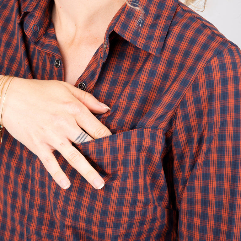 alpkit womens kanza shirt for gravel riding and bikepacking in brick red pocket