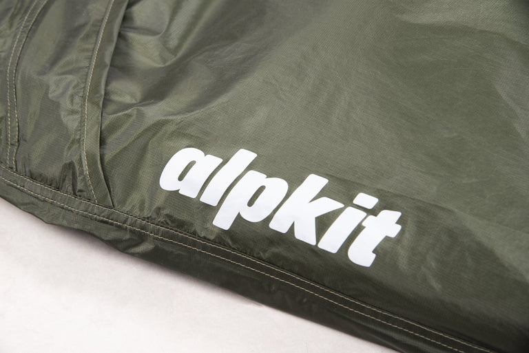 alpkit kloke lightweight bivy bag in kelp logo