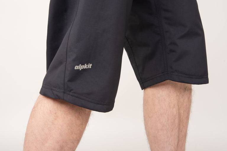 alpkit mens nimbus waterproof mountain bike shorts in black logo 