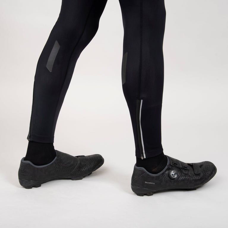 alpkit mens rhythm four season bib tights in black hem and reflective stripes