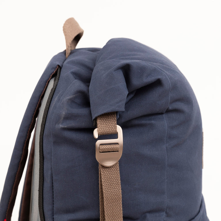 alpkit tyrol backpack in navy blue roll top