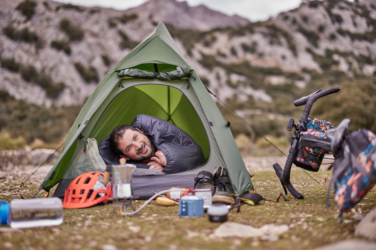 Yazan bikepacking in a lightweight backpacking tent with an ultralight PrimaLoft® sleeping bag - action - closed