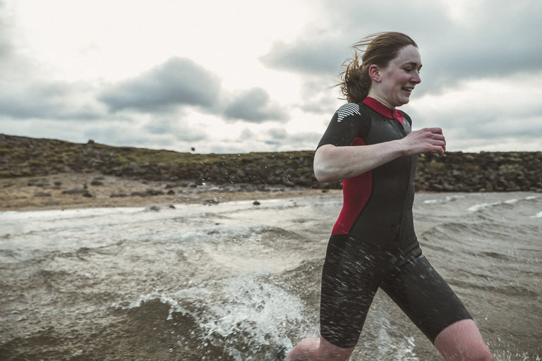 alpkit duel womens swim run wetsuit in red and black