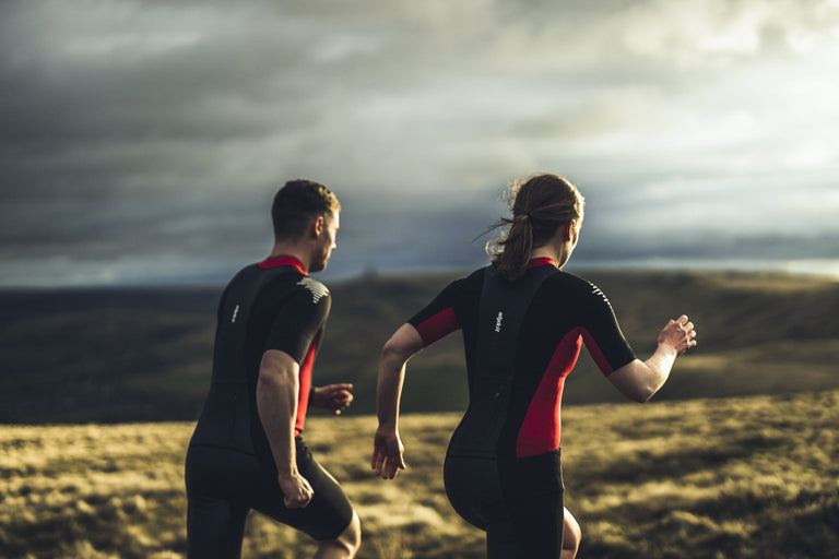 alpkit duel womens swim run wetsuit in red and black